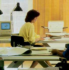 Shows a Mac & LaserWriter. This is from the Macintosh 512Ke user manual.